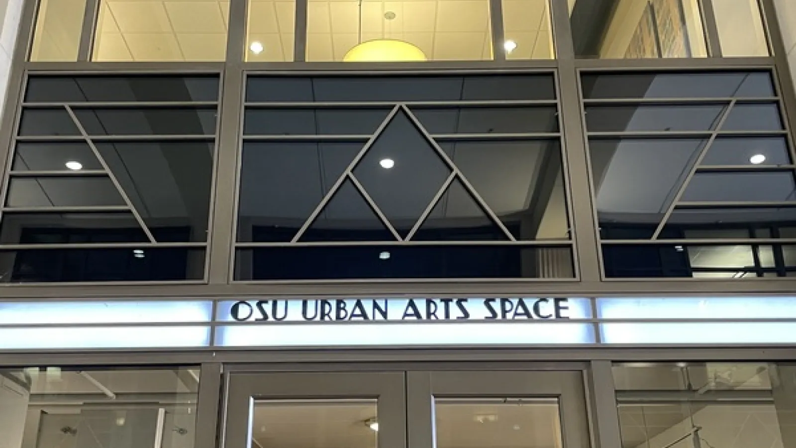 Front of the OSU Urban Arts Space with geometric shapes against black glass