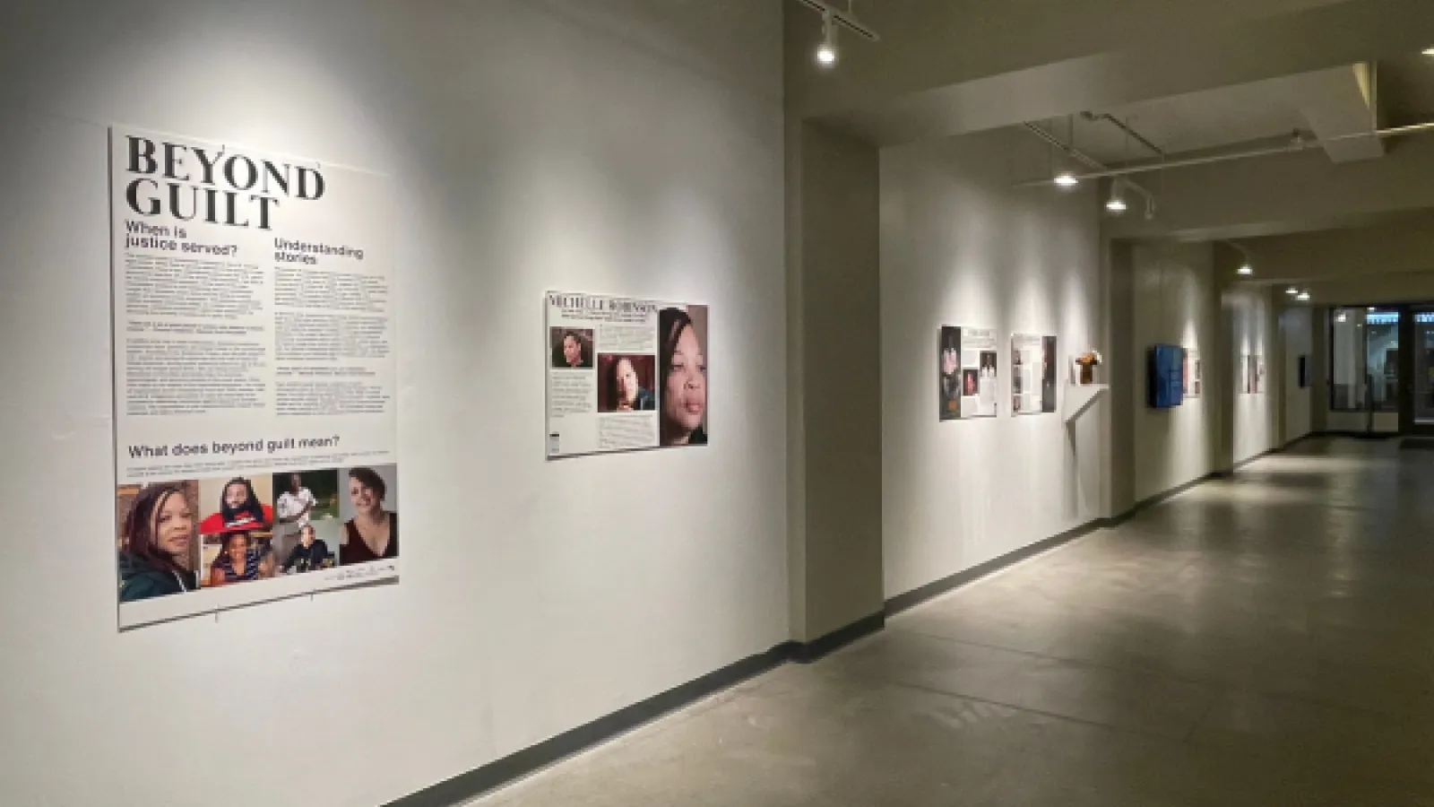 Beyond Guilt signs in the Urban Arts Space corridor