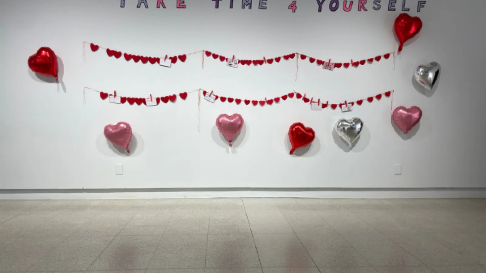 words on the wall: take time for yourself and heart balloons