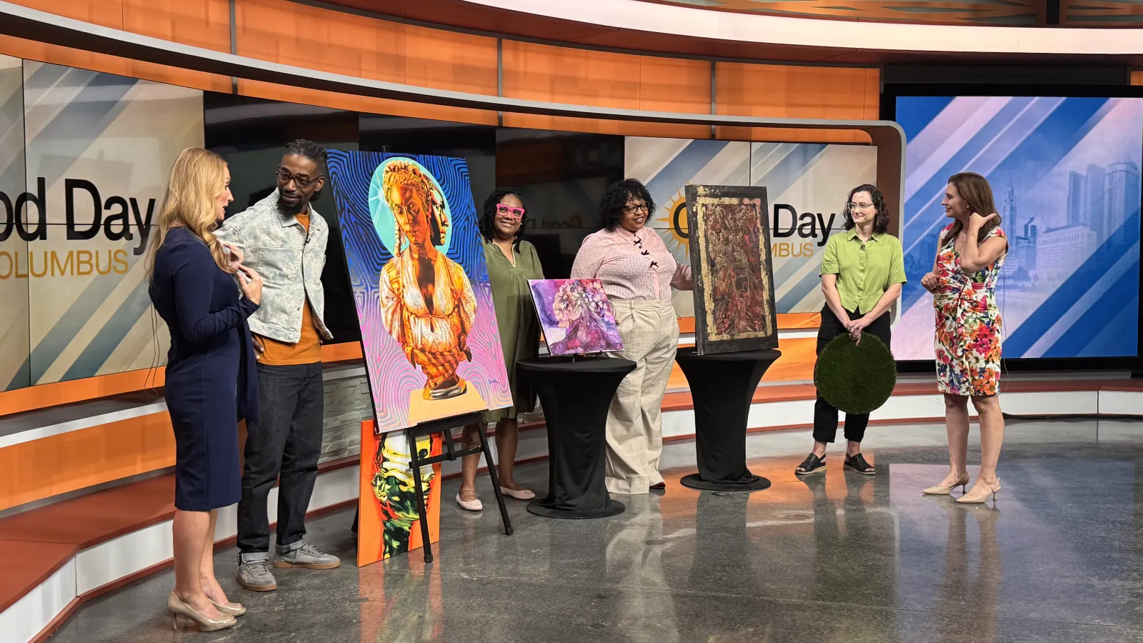 Artists with their artwork and news anchors on Good Day Columbus