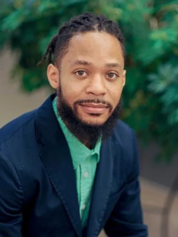 terron in a blue suit with green shirt