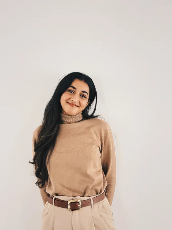 Mawadah smiling on a white background
